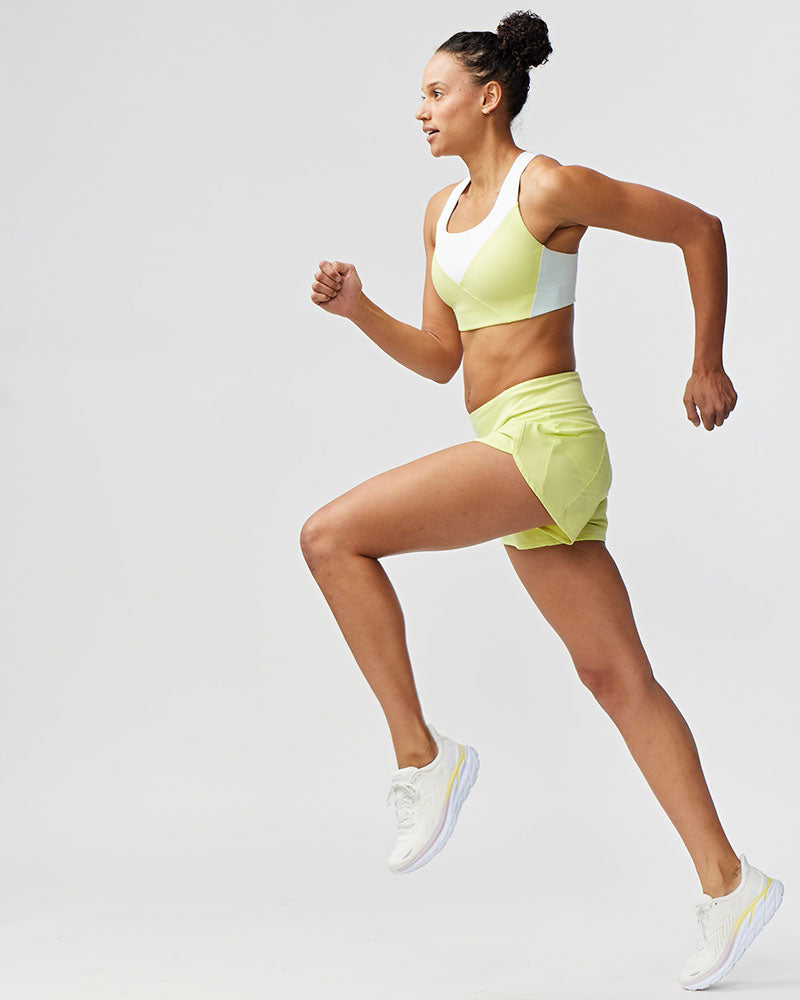 Women's high-rise running shorts in limelight green
